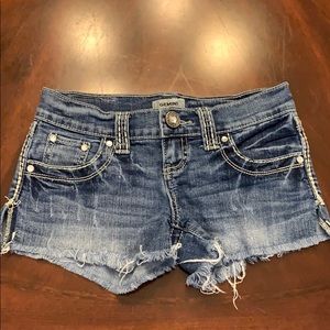 Daytrip - Gemini size 24 denim shorts with fringe